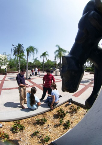 Kids posing with the panther statue